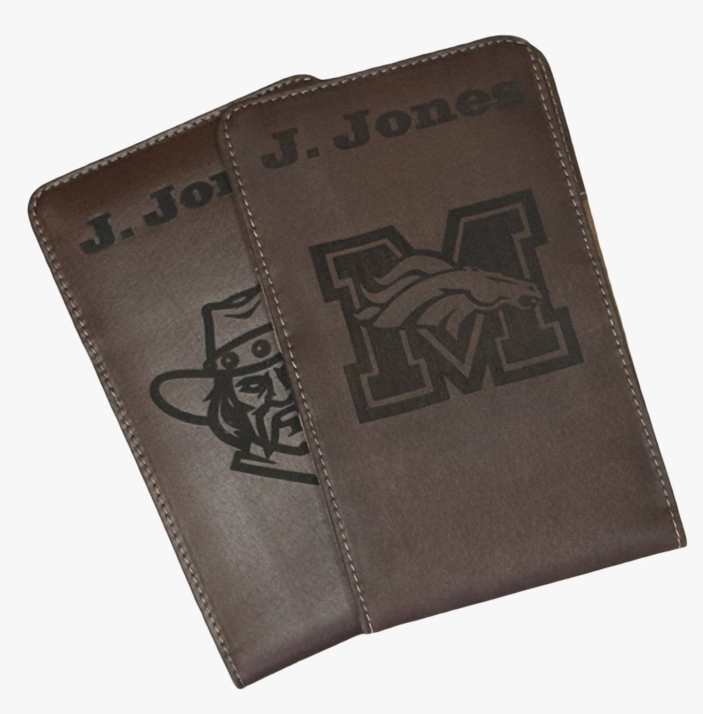 Two brown leather cases with engraved logos on a white background