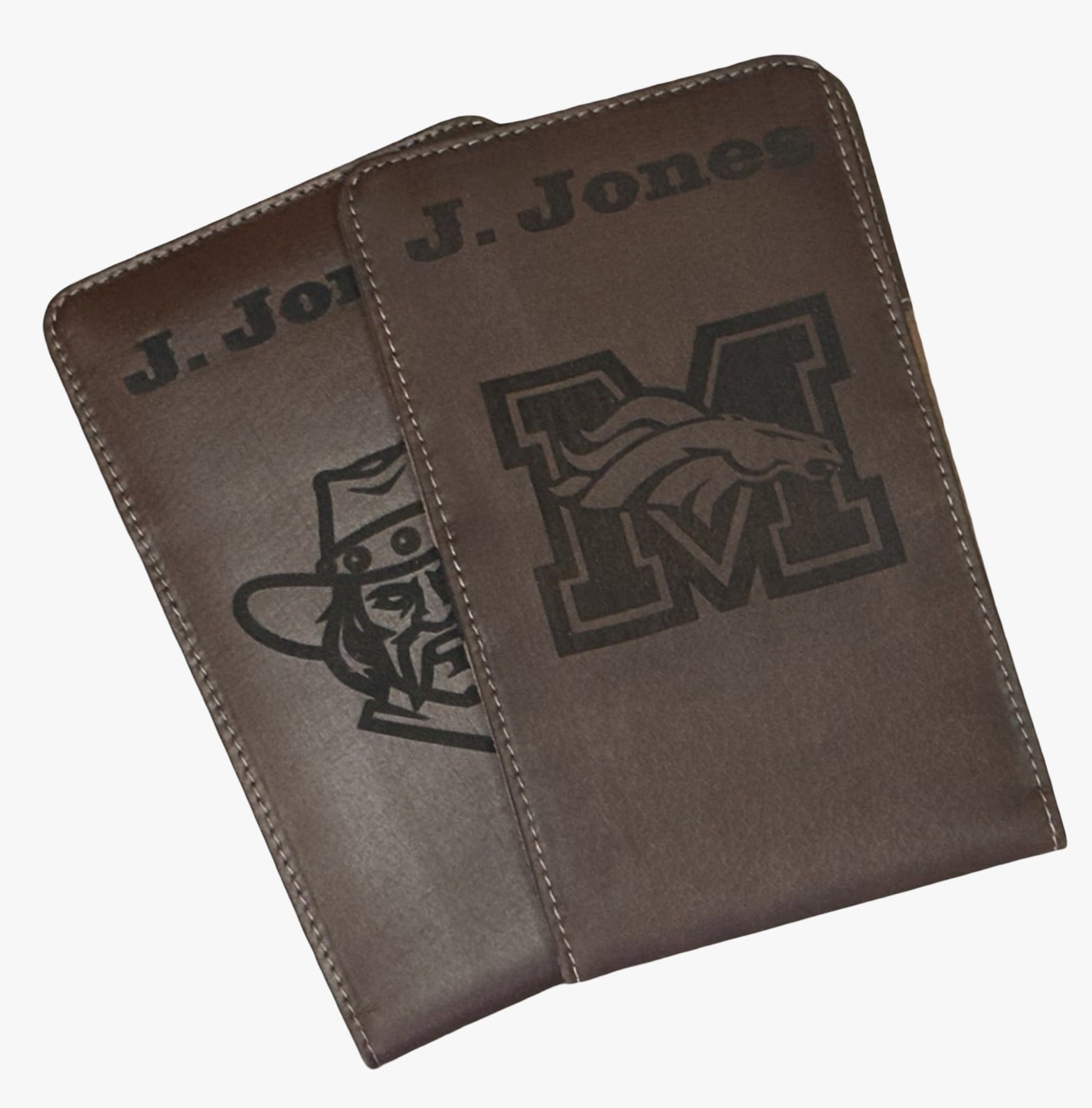 Two brown leather cases with engraved logos on a white background