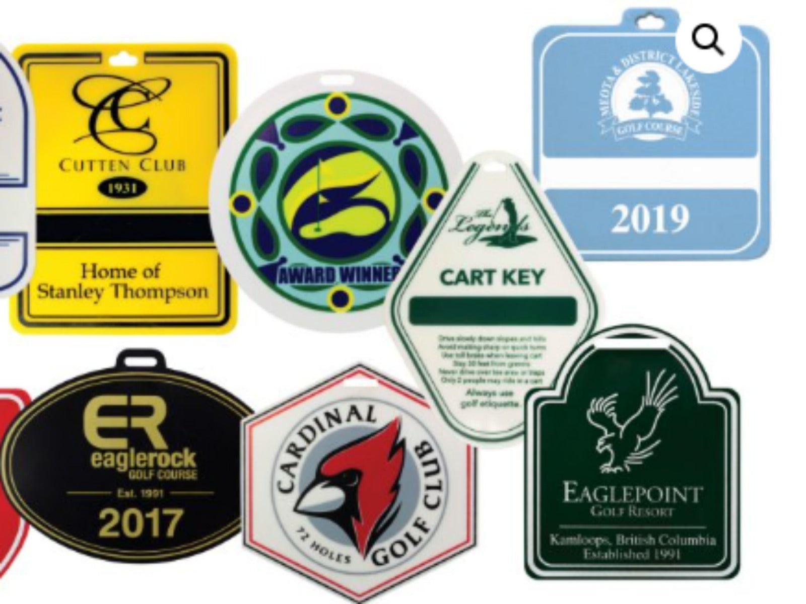 Collection of various golf club keys and tags with different designs and text.